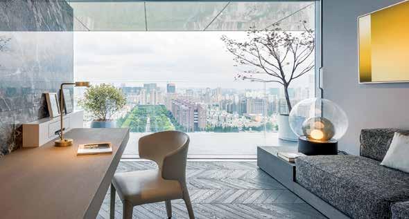 The synthesis of luxurious materials, rich textures and high-contrast surfaces creates a "sanctuary" of quiet elegance, with breath-taking views towards the Chinese megapolis skyline.