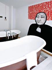 The New Majestic s cunningly madcap design hanging beds, his-and-her outdoor bathtubs, porthole windows on the floor of the pool that peer into the hotel restaurant have made headlines and brought on