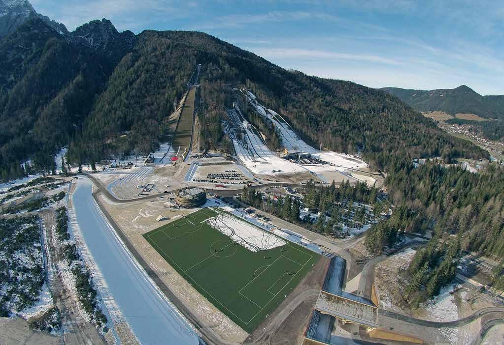 Stavbna tehnika Zaživel je Nordijski center Planica Polonca Pagon Planica, ta ledeniška dolina v severozahodnem delu Julijskih Alp, ki se razteza od naselja Rateče pa do planinske postojanke Dom v