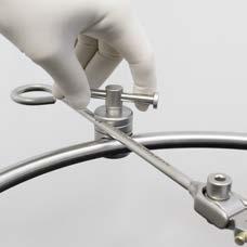 by clipping into the side of the circle joint.