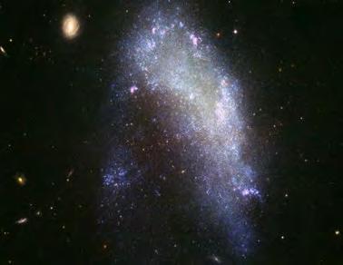 ellipties lensvormig onreëlmatig 'n Spiraalgalaksie genaamd NGC 4414 BESOEK Wat is die heelal?
