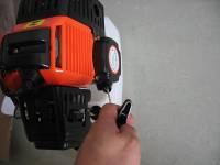 Pull the recoil starter handle