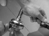 4. Assemble the cutting head. Release the nut.