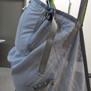 To adjust the head support, tighten the straps as needed for